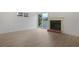 Bright living area featuring wood floors, fireplace and access to outdoor living space at 1590 Landing Rd., Myrtle Beach, SC 29577