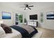 Bright main bedroom featuring a ceiling fan, sliding glass doors, and stylish decor at 1590 Landing Rd., Myrtle Beach, SC 29577