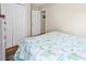 Bedroom with closet, white trim, and a queen bed featuring stylish coastal themed linens at 17 South Oak Dr., Surfside Beach, SC 29575