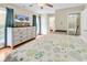 Bedroom featuring a dresser, TV, king sized bed and hardwood flooring at 17 South Oak Dr., Surfside Beach, SC 29575