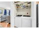 Convenient laundry closet featuring a washer and dryer, and built-in shelving at 17 South Oak Dr., Surfside Beach, SC 29575