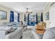 Bright living room featuring hardwood floors, gray sofas and a blue entertainment center at 17 South Oak Dr., Surfside Beach, SC 29575