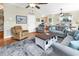 Comfortable living room with hardwood floors, a ceiling fan, and a unique coffee table at 17 South Oak Dr., Surfside Beach, SC 29575