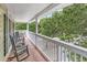 Relaxing porch with rocking chairs overlooking a beautifully wooded yard at 17 South Oak Dr., Surfside Beach, SC 29575