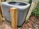 Close up of new gray Rheem central air conditioner unit at 1744 John St., Conway, SC 29527