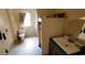 Modest bathroom featuring a toilet, sink with vanity, and window providing natural light at 1744 John St., Conway, SC 29527