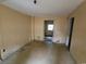 Bedroom featuring stained flooring, plain walls and access to adjacent rooms at 1744 John St., Conway, SC 29527