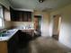 Kitchen featuring a stainless steel sink, dark cabinets, and access to adjacent rooms at 1744 John St., Conway, SC 29527