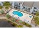 An aerial view captures the community pool, spa, and attractive condo buildings at 1891 Colony Dr. # 15 J, Surfside Beach, SC 29575
