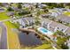 An aerial shot showcases the community's pool and surrounding lush landscaping at 1891 Colony Dr. # 15 J, Surfside Beach, SC 29575
