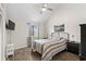 Cozy bedroom with vaulted ceiling, ceiling fan, modern decor and a large window at 1891 Colony Dr. # 15 J, Surfside Beach, SC 29575