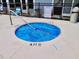 An in-ground hot tub with a blue cover offers a relaxing way to unwind at 1891 Colony Dr. # 15 J, Surfside Beach, SC 29575