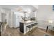 Charming kitchen featuring a breakfast bar, white cabinetry, and modern appliances, perfect for casual dining and meal preparation at 1891 Colony Dr. # 15 J, Surfside Beach, SC 29575