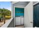 Small laundry room on balcony with full size washer, dryer, shelving, and access to pretty views at 1891 Colony Dr. # 15 J, Surfside Beach, SC 29575