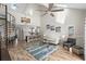 Open-concept living room with vaulted ceilings, a spiral staircase, and plenty of natural light, perfect for modern living at 1891 Colony Dr. # 15 J, Surfside Beach, SC 29575