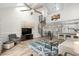 Bright living room featuring high ceilings, a spiral staircase, and stylish decor, creating a modern and inviting space at 1891 Colony Dr. # 15 J, Surfside Beach, SC 29575