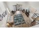 Open-concept living room with tall ceilings, spiral staircase, and a view of the outdoor balcony, an ideal spot for relaxation at 1891 Colony Dr. # 15 J, Surfside Beach, SC 29575