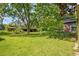Expansive backyard with mature trees, offering privacy and shade, next to the home at 1895 Bucksville Dr., Conway, SC 29527