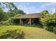 Open air garage with brick columns needing repair, surrounded by a green lawn at 1895 Bucksville Dr., Conway, SC 29527