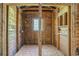 A rustic unfinished bathroom featuring wood paneling, ready for customization to your personal taste at 1895 Bucksville Dr., Conway, SC 29527
