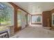 Bright and airy enclosed porch featuring brick walls and large windows offering serene outdoor views at 1895 Bucksville Dr., Conway, SC 29527