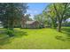Charming brick home with lush green lawn, mature trees, and inviting curb appeal at 1895 Bucksville Dr., Conway, SC 29527