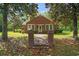 Charming brick home with a brick walkway leading to the entrance, framed by mature trees at 1895 Bucksville Dr., Conway, SC 29527