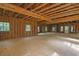 Large unfinished garage featuring exposed wood beams, awaiting transformation into your ideal space at 1895 Bucksville Dr., Conway, SC 29527