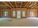 Large unfinished room with natural light coming in from multiple windows and a door at 1895 Bucksville Dr., Conway, SC 29527