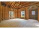 An interior view of unfinished room with raw walls and wooden beams, awaiting transformation at 1895 Bucksville Dr., Conway, SC 29527