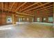 Vast unfinished room featuring exposed wooden beams, framing, and natural light from multiple windows at 1895 Bucksville Dr., Conway, SC 29527