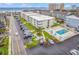 Aerial view of community showcasing residential building with a community pool at 191 Maison Dr. # B-123, Myrtle Beach, SC 29572