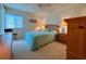 Bright bedroom featuring a queen bed, a ceiling fan, and wood furnishings at 191 Maison Dr. # B-123, Myrtle Beach, SC 29572