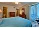 Bedroom with queen bed, furnishings, and sliding glass doors to the outdoor patio at 191 Maison Dr. # B-123, Myrtle Beach, SC 29572
