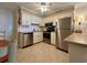 Well-equipped kitchen featuring stainless steel appliances and white cabinetry for a clean look at 191 Maison Dr. # B-123, Myrtle Beach, SC 29572