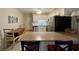 View of the eat-in kitchen featuring updated appliances and a breakfast bar with seating at 191 Maison Dr. # B-123, Myrtle Beach, SC 29572
