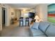 Cozy living room and kitchen area with bar seating and comfortable sofa at 191 Maison Dr. # B-123, Myrtle Beach, SC 29572