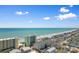 Stunning aerial view showcasing oceanfront condos, single Gathering homes, and picturesque coastline at 200 53Rd Ave. N # 209, North Myrtle Beach, SC 29582