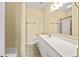 Bathroom featuring a white vanity and sink with a tub and shower, neutral walls, and tile floors at 200 53Rd Ave. N # 209, North Myrtle Beach, SC 29582