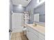 Bathroom featuring a white vanity and sink with a tub and shower combo, and neutral tile floors at 200 53Rd Ave. N # 209, North Myrtle Beach, SC 29582