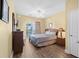 Bedroom features hardwood floors, ceiling fan, and glass doors leading to a balcony at 200 53Rd Ave. N # 209, North Myrtle Beach, SC 29582