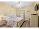 Bright bedroom featuring a decorative floral comforter and wicker furniture at 200 53Rd Ave. N # 209, North Myrtle Beach, SC 29582