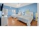 Bright bedroom features two beds with white linens, coordinating nightstands, window, and wood-look flooring at 200 53Rd Ave. N # 209, North Myrtle Beach, SC 29582
