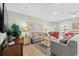 Well-lit living room with tile floors, comfortable seating, and tasteful decor at 200 53Rd Ave. N # 209, North Myrtle Beach, SC 29582