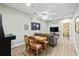 Cozy living area with wood floors, a dining table, a sofa, and a mounted television at 200 53Rd Ave. N # 209, North Myrtle Beach, SC 29582