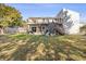 Backyard with a cozy patio and staircase to upper deck, perfect for outdoor entertaining at 2005 Havens Dr., North Myrtle Beach, SC 29582