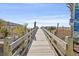 Inviting wooden walkway to the beach with railings and signage for easy access at 2005 Havens Dr., North Myrtle Beach, SC 29582