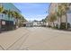 Beach entrance with parking and a convenient restroom, surrounded by palm trees at 2005 Havens Dr., North Myrtle Beach, SC 29582