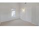 Bright bedroom features neutral carpet, white trim, and natural light through a window at 2005 Havens Dr., North Myrtle Beach, SC 29582