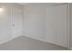 Bedroom with neutral carpet, a closet, and a white door entering the room at 2005 Havens Dr., North Myrtle Beach, SC 29582